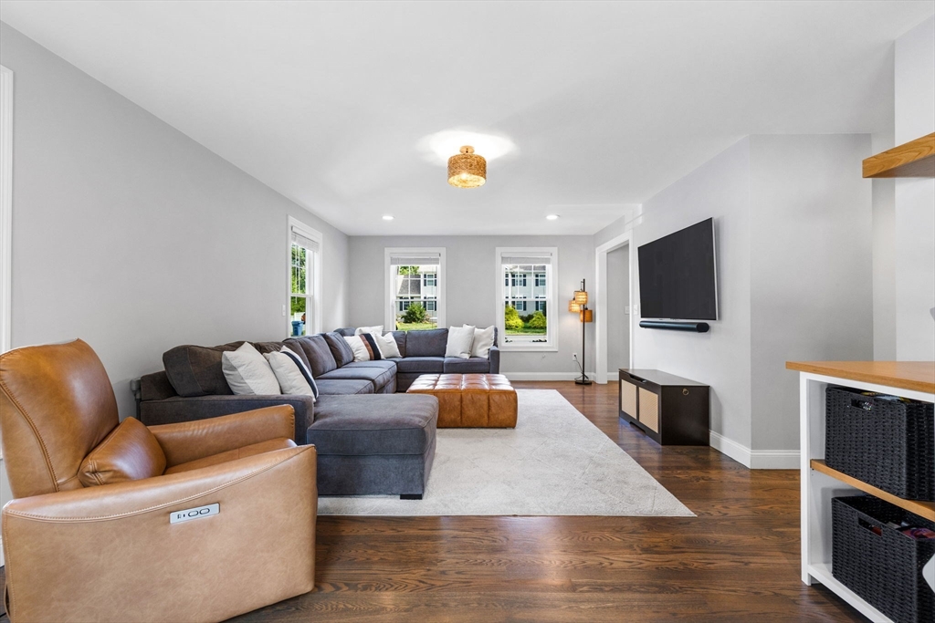 138 Dedham Street Canton, MA 02021 - Photo 16 of 41 a living room with fireplace furniture and a flat screen tv