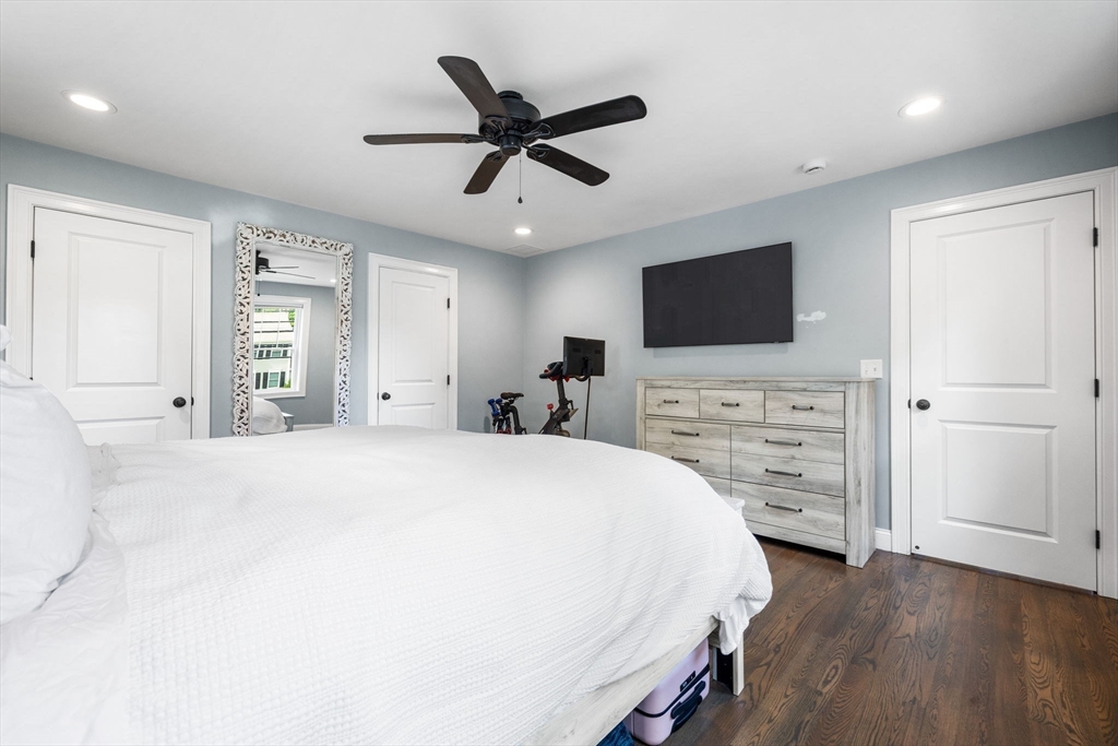 138 Dedham Street Canton, MA 02021 - Photo 20 of 41 a spacious bedroom with a bed and a flat screen tv