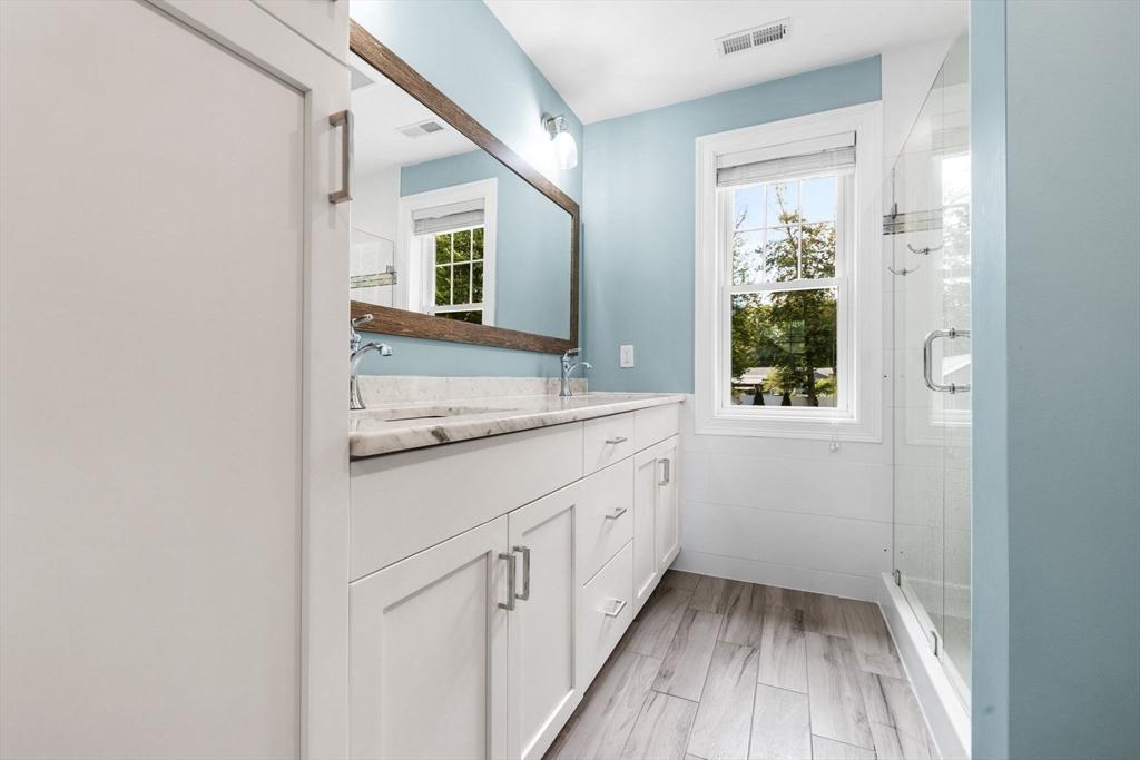 138 Dedham Street Canton, MA 02021 - Photo 22 of 41 a bathroom with a sink and a mirror