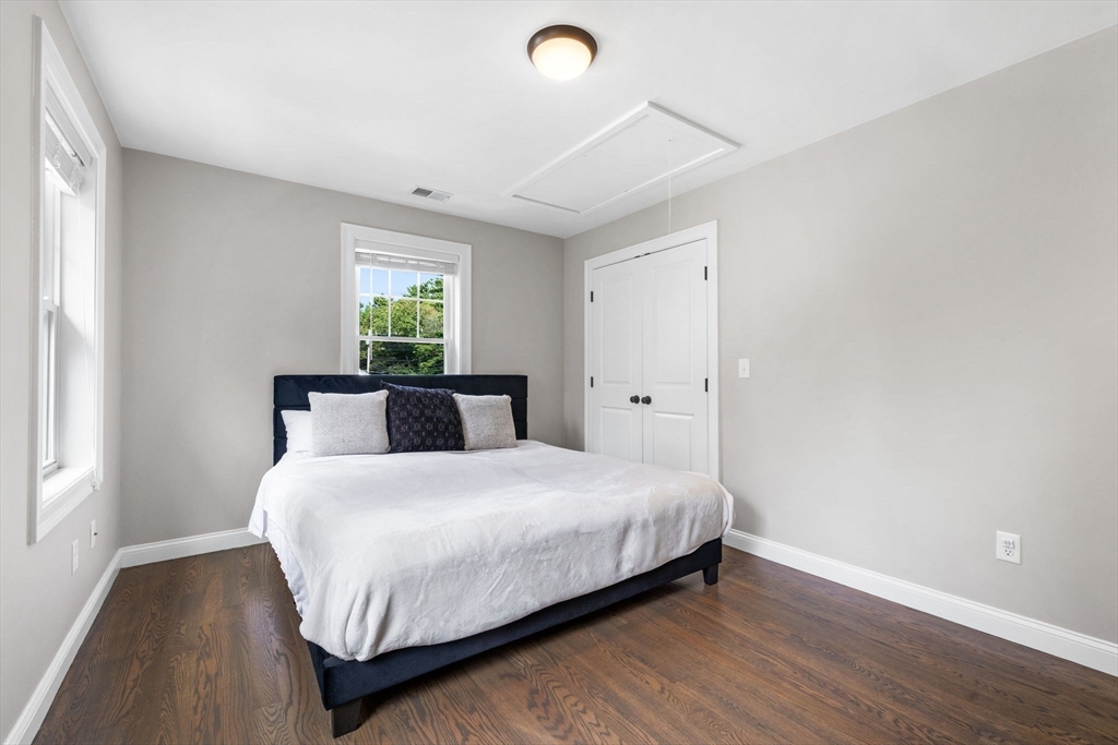 138 Dedham Street Canton, MA 02021 - Photo 28 of 41 a bedroom with a bed and window