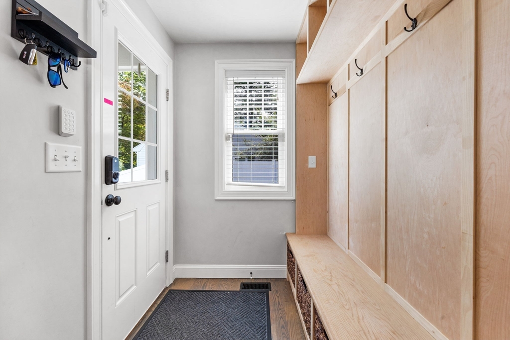 138 Dedham Street Canton, MA 02021 - Photo 29 of 41 a view of a hallway with wooden floor and windows