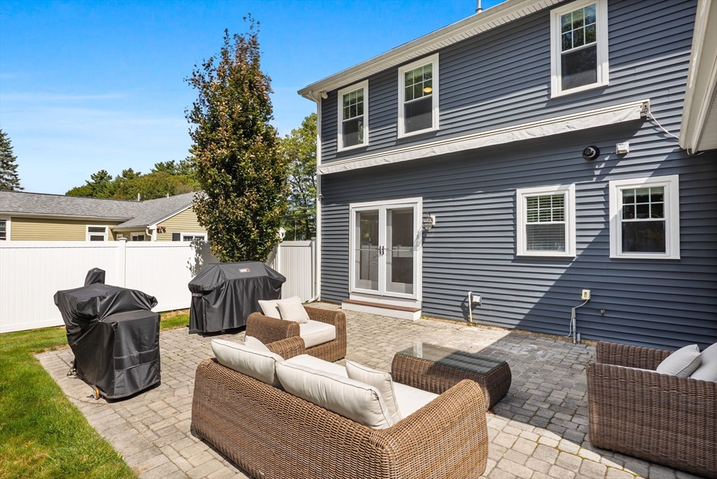 138 Dedham Street Canton, MA 02021 - Photo 31 of 41 a view of a patio with couches chairs and potted plants