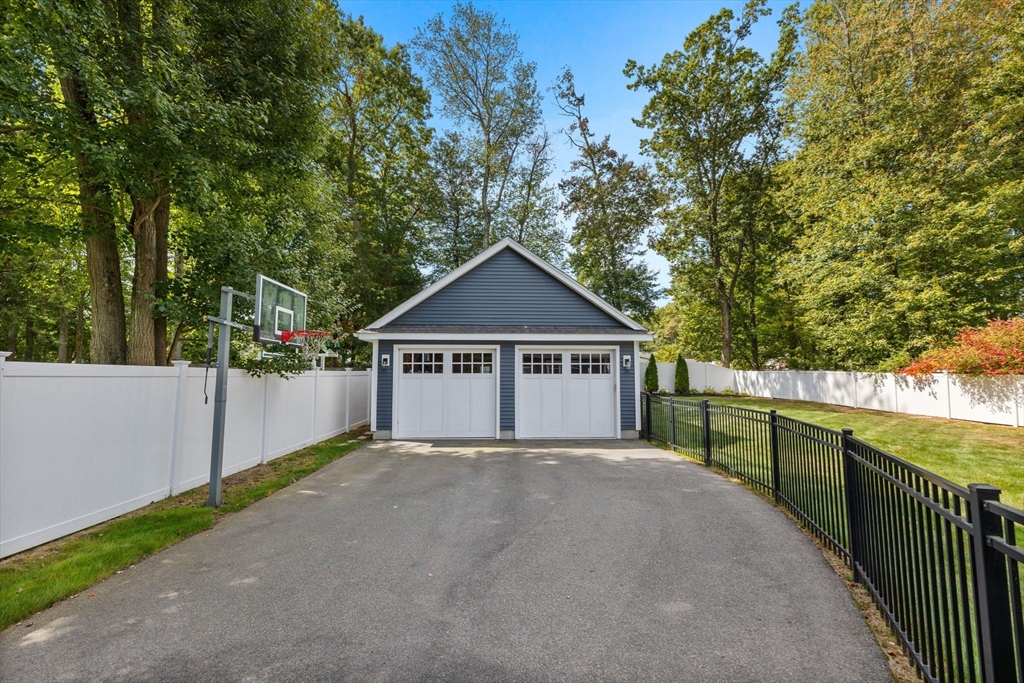 138 Dedham Street Canton, MA 02021 - Photo 34 of 41 a view of a house with a yard and large tree