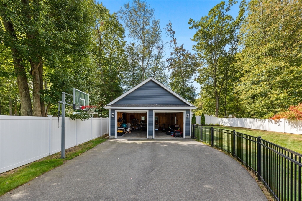 138 Dedham Street Canton, MA 02021 - Photo 35 of 41 a view of a house with a yard and large tree