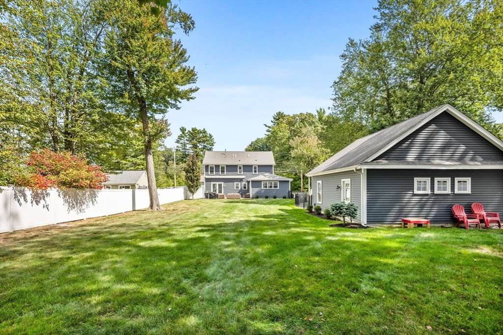 138 Dedham Street Canton, MA 02021 - Photo 39 of 41 a front view of a house with a yard and trees