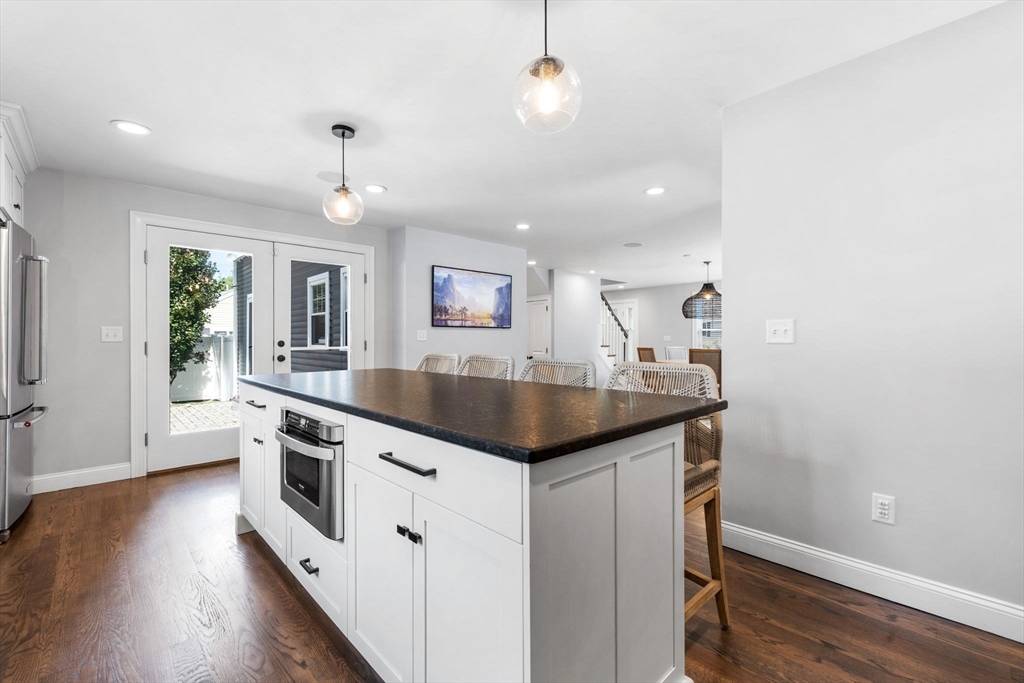 138 Dedham Street Canton, MA 02021 - Photo 4 of 41 a kitchen with granite countertop a sink and stove top oven