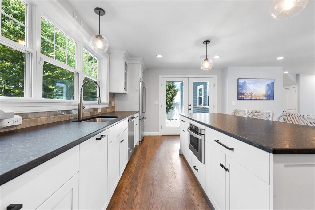 138 Dedham Street Canton, MA 02021 - Photo 5 of 41 a large kitchen with granite countertop a large counter top