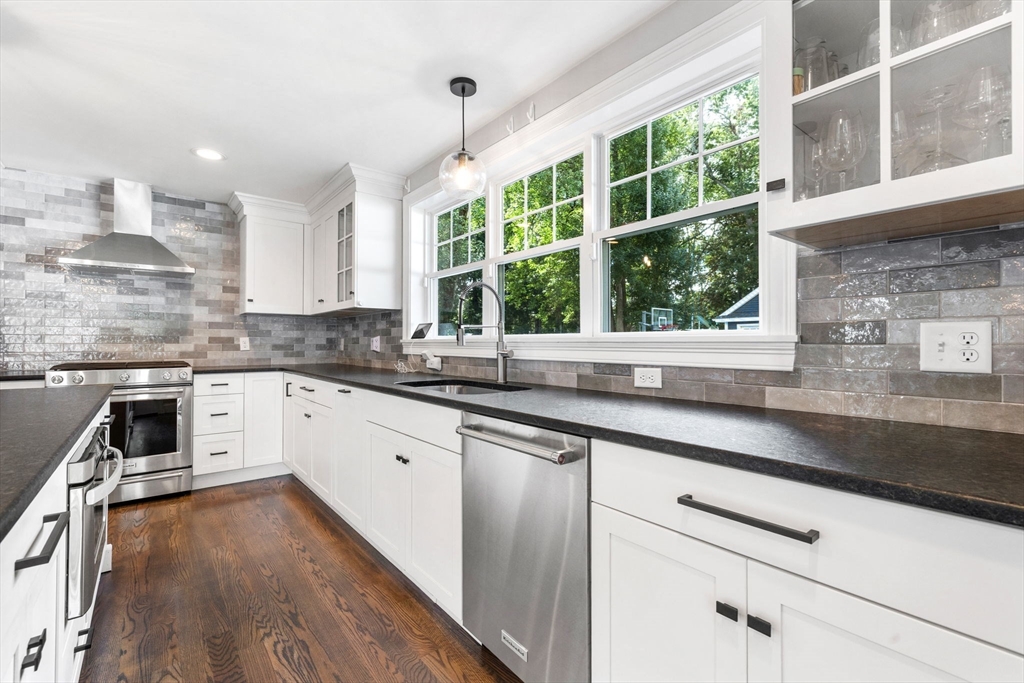 138 Dedham Street Canton, MA 02021 - Photo 7 of 41 a kitchen with a sink window and cabinets