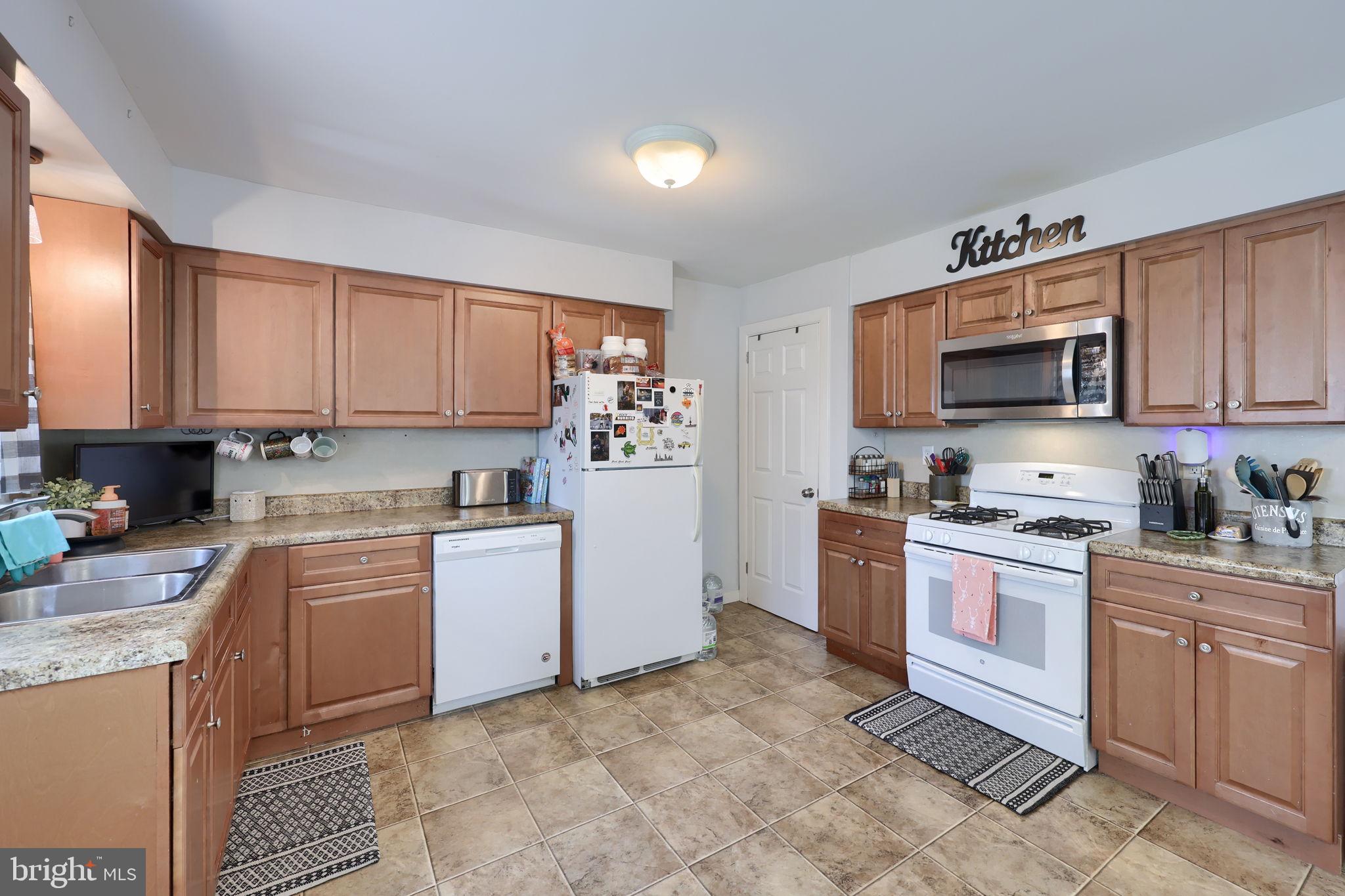 508 West Marion Street Lititz, PA 17543 - Photo 13 of 32 a kitchen with granite countertop cabinets stainless steel appliances and a counter space