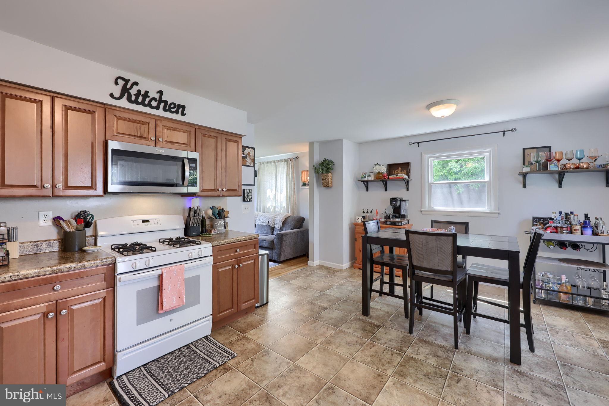 508 West Marion Street Lititz, PA 17543 - Photo 16 of 32 a kitchen with a stove a sink cabinets and dining table