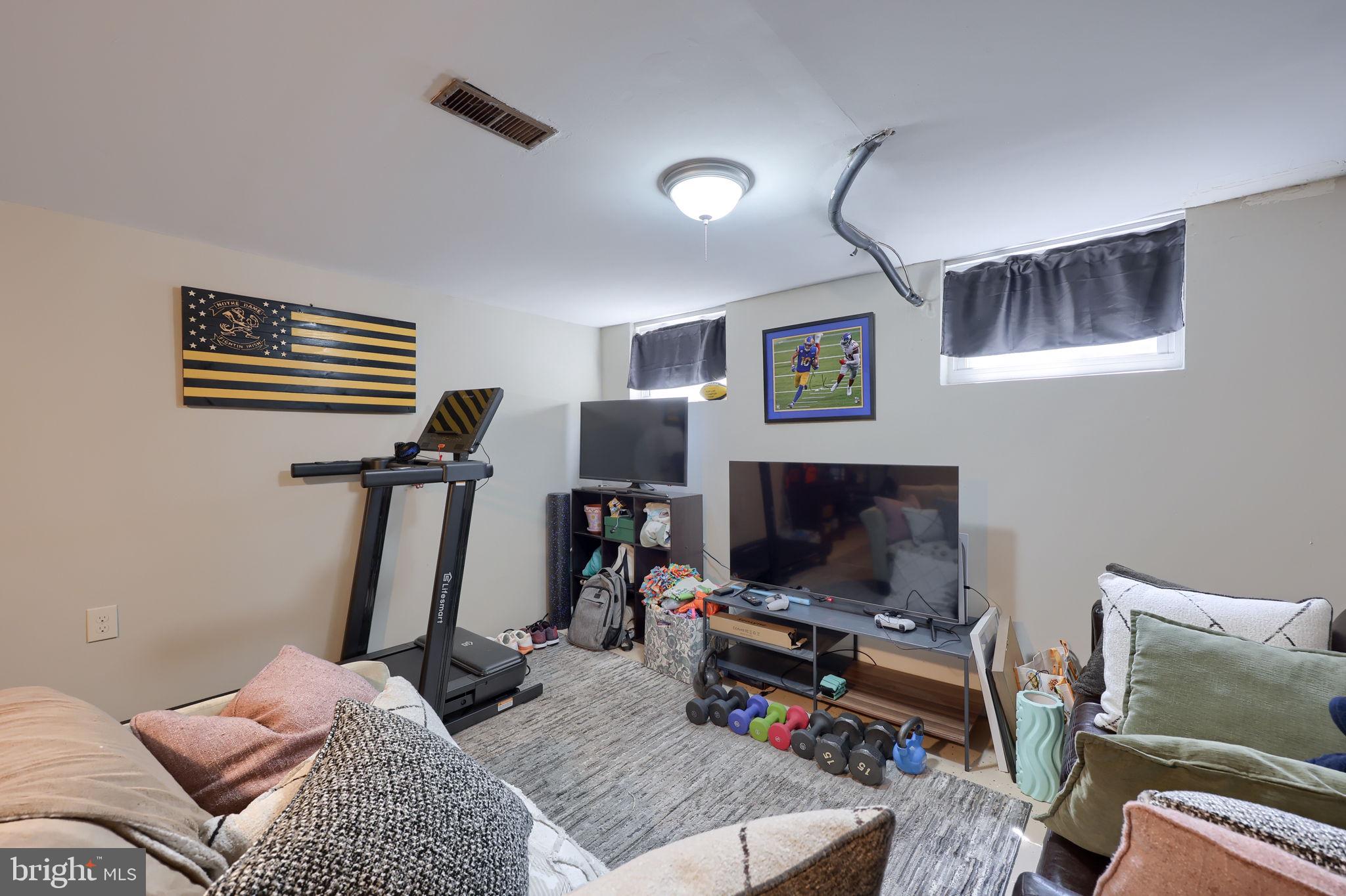 508 West Marion Street Lititz, PA 17543 - Photo 27 of 32 a bedroom with furniture and a flat screen tv