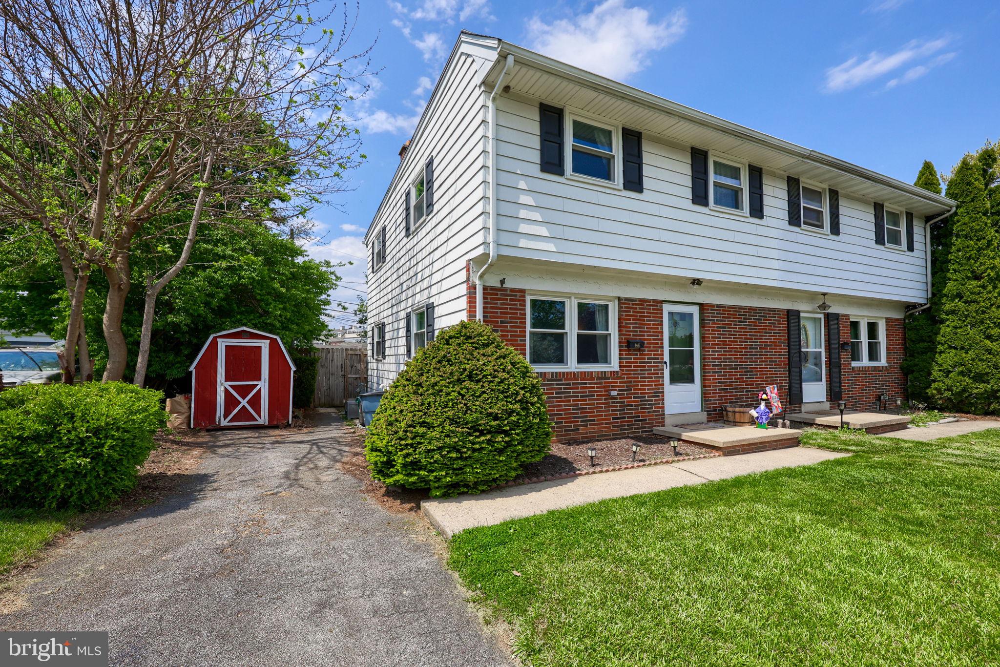 508 West Marion Street Lititz, PA 17543 - Photo 3 of 32 a front view of a house with a garden