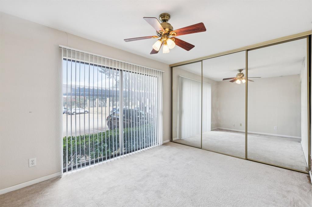 4569 North O'Connor Road, Unit 1320 Irving, TX 75062 - Photo 15 of 24 a view of a livingroom with a ceiling fan and window