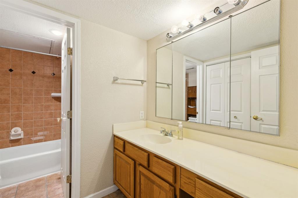 4569 North O'Connor Road, Unit 1320 Irving, TX 75062 - Photo 18 of 24 a bathroom with a sink and a mirror