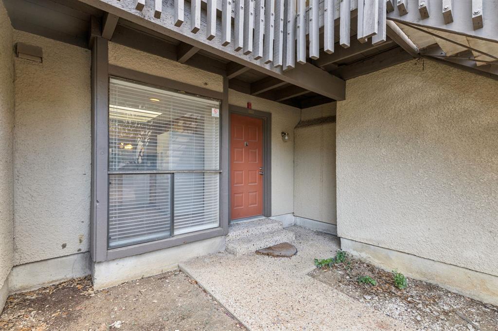 4569 North O'Connor Road, Unit 1320 Irving, TX 75062 - Photo 2 of 24 a backyard of a house with barbeque oven table and chairs