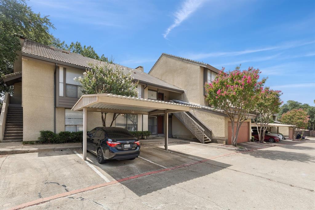 4569 North O'Connor Road, Unit 1320 Irving, TX 75062 - Photo 24 of 24 a car parked in front of white house