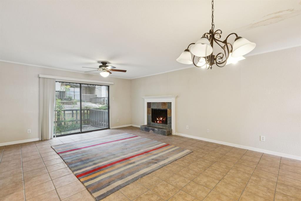 4569 North O'Connor Road, Unit 1320 Irving, TX 75062 - Photo 5 of 24 a bedroom with a bed and a chandelier