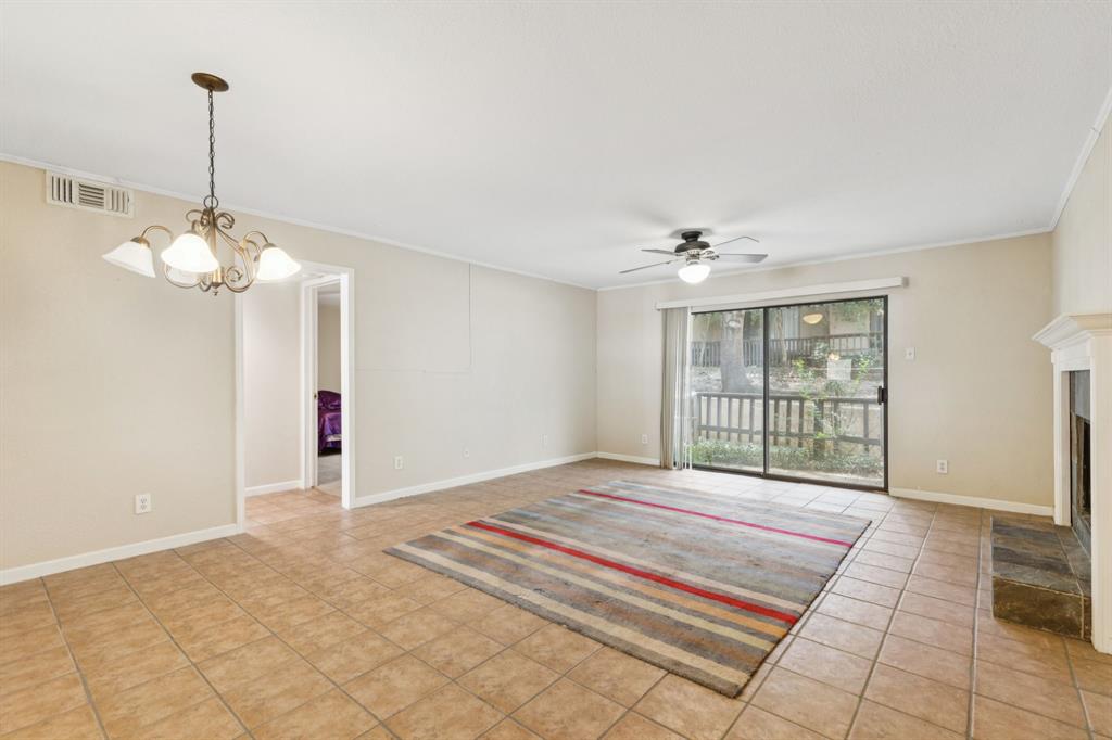 4569 North O'Connor Road, Unit 1320 Irving, TX 75062 - Photo 6 of 24 a view of an empty room with chandelier and a window