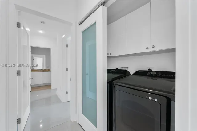 a kitchen with a refrigerator and a stove