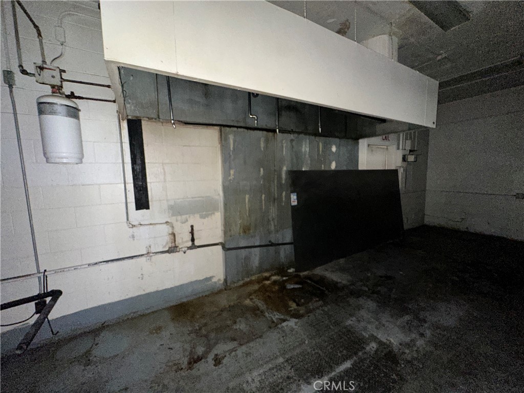 230 Fox Street Lemoore, CA 93245 - Photo 18 of 25 a room with two washing machine and wooden walls