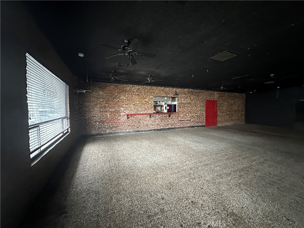 230 Fox Street Lemoore, CA 93245 - Photo 5 of 25 a view of water heater room with ceiling fan