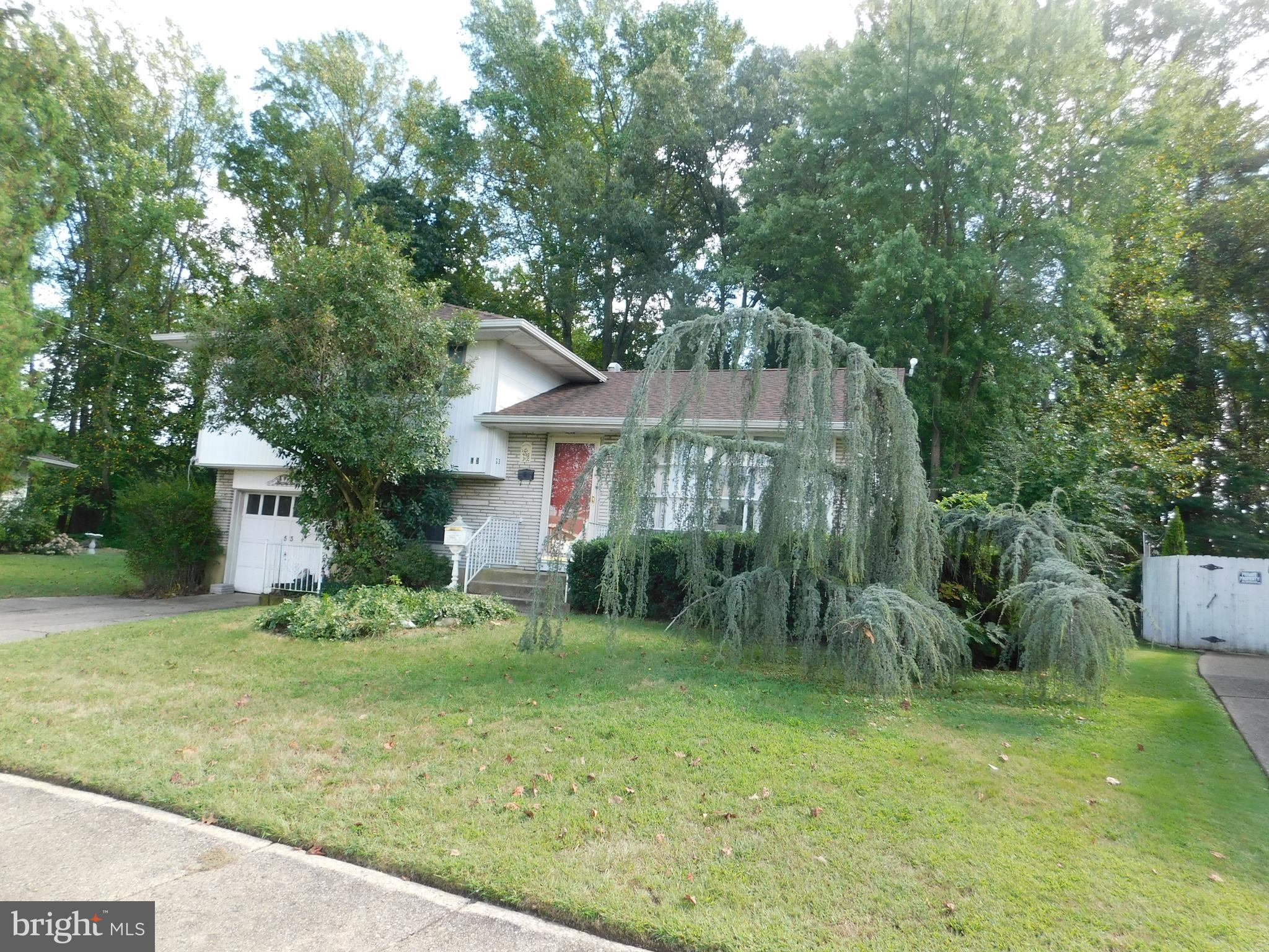 53 Lillian Place Glendora, NJ 08029 - Photo 3 of 6 a front view of a house with a yard