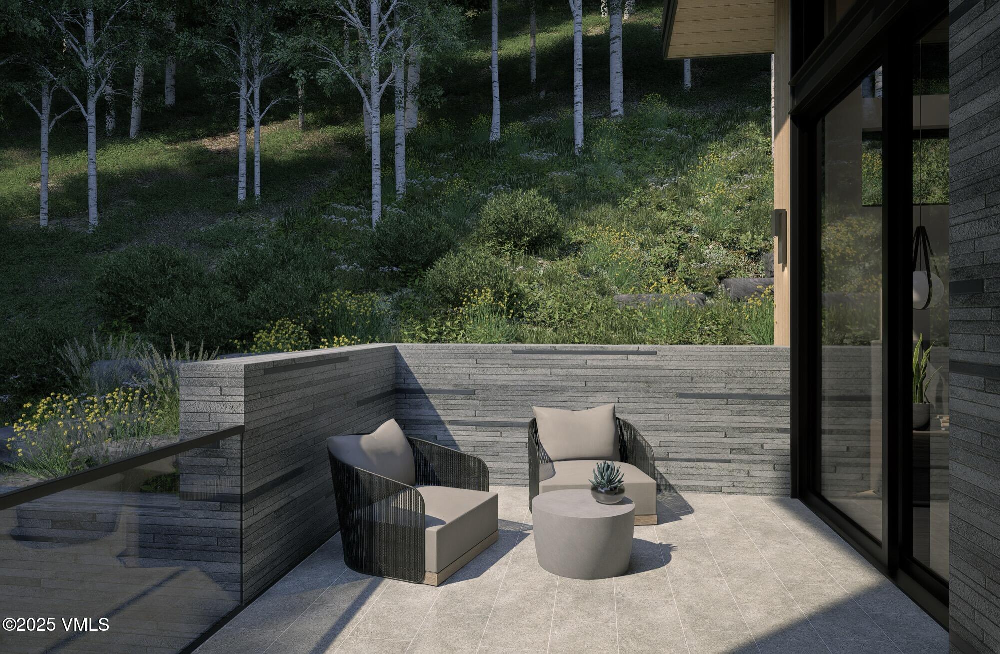 1150 Ptarmigan Road Vail, CO 81657 - Photo 17 of 36 a view of backyard with seating space and plants