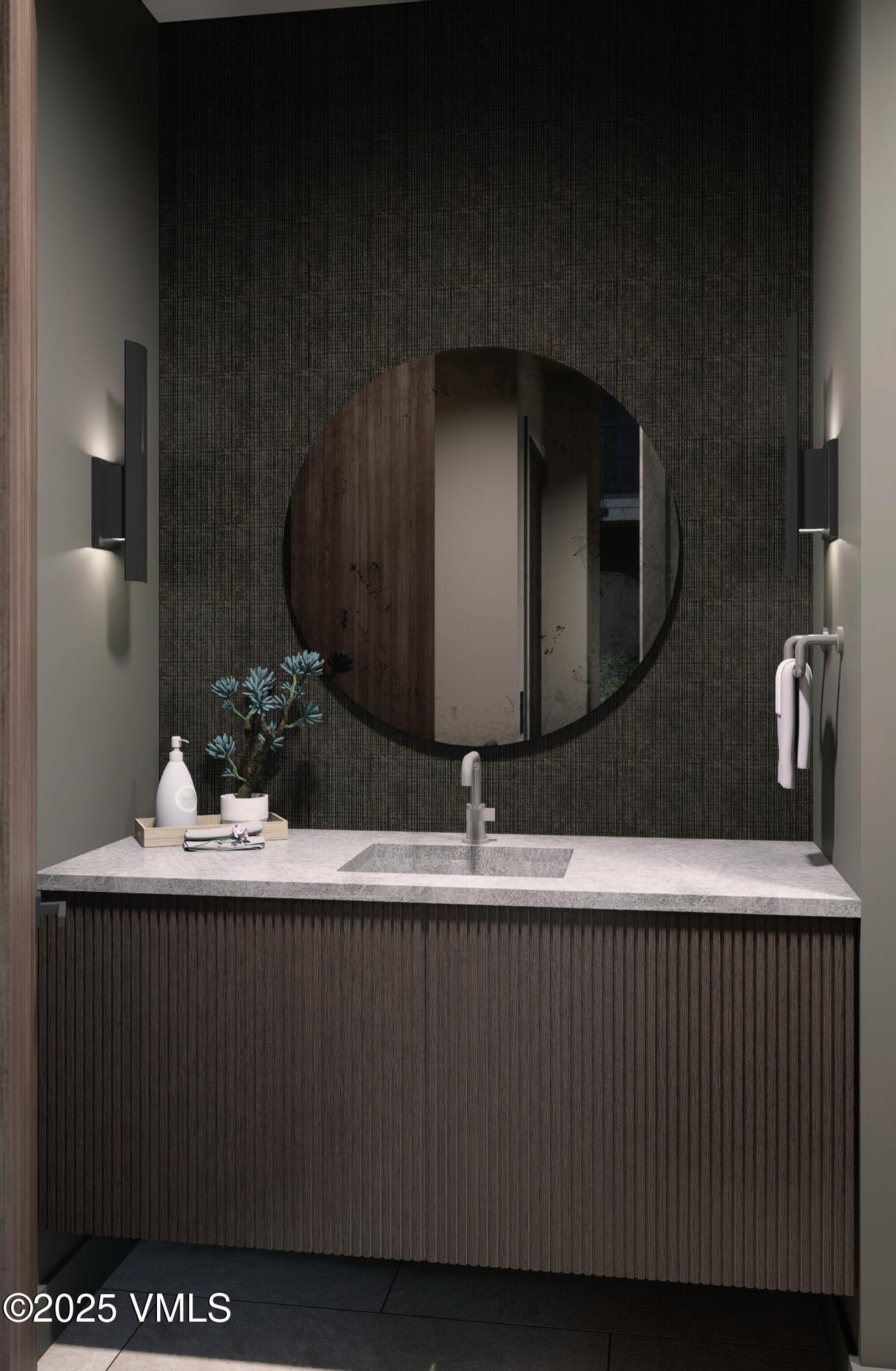 1150 Ptarmigan Road Vail, CO 81657 - Photo 20 of 36 a bathroom with a sink and a mirror