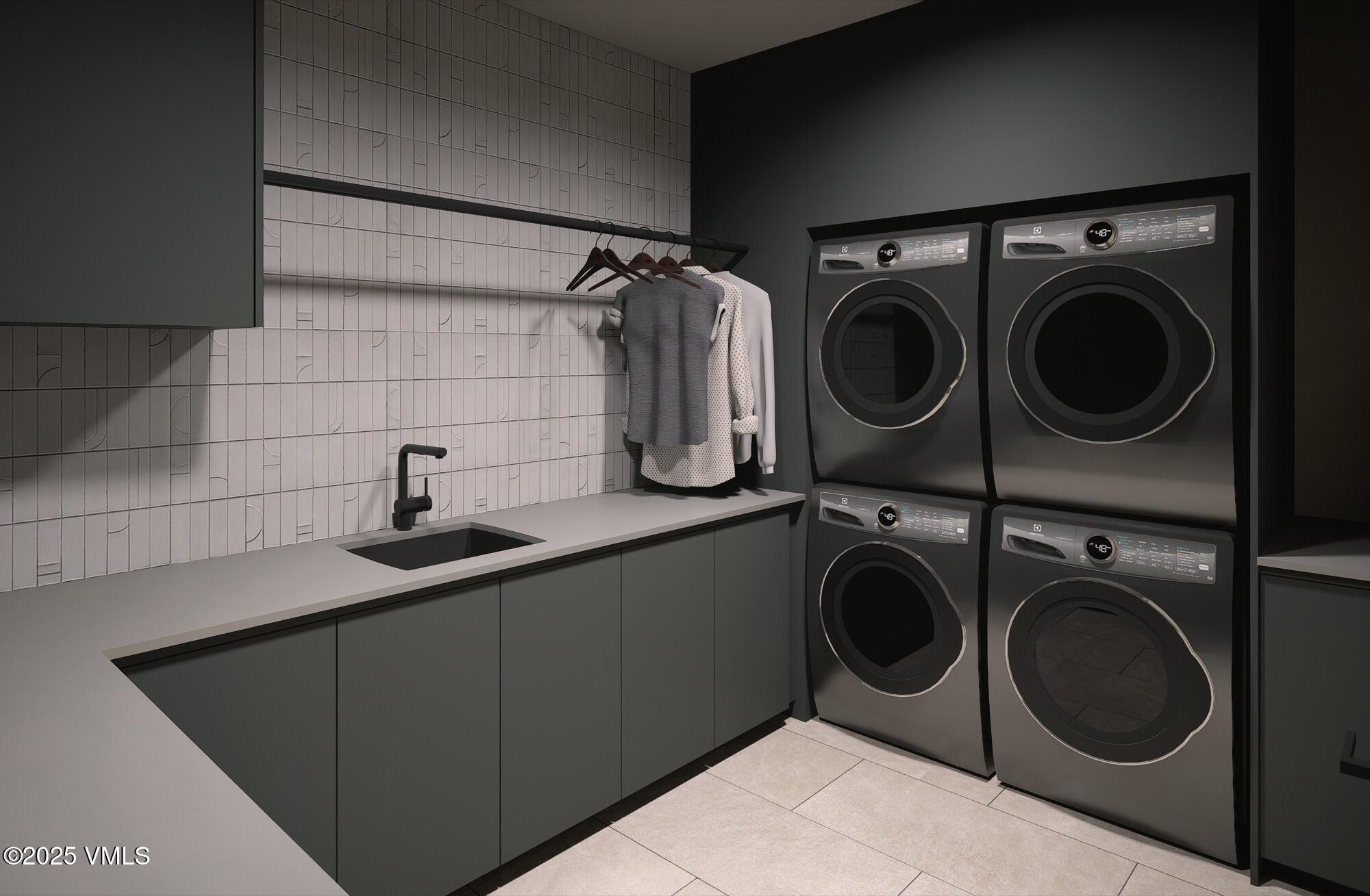 1150 Ptarmigan Road Vail, CO 81657 - Photo 31 of 36 a utility room with sink dryer and washer