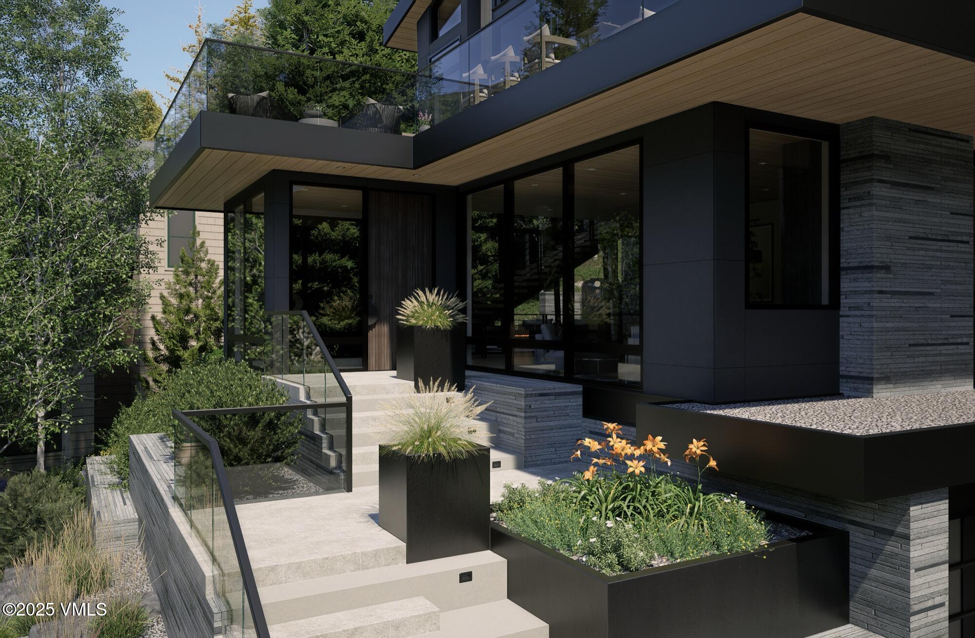 1150 Ptarmigan Road Vail, CO 81657 - Photo 32 of 36 a front view of a house with a yard