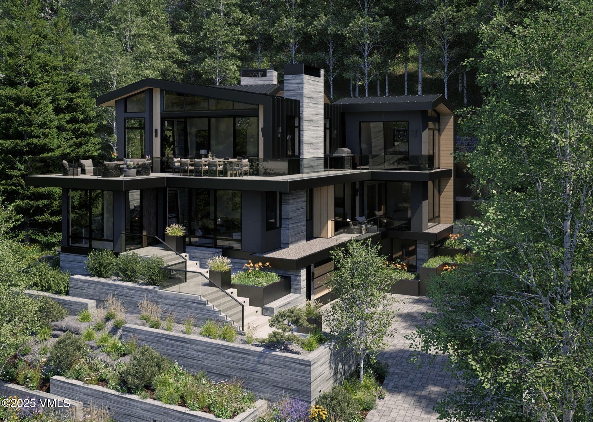 1150 Ptarmigan Road Vail, CO 81657 - Photo 33 of 36 a view of house with yard outdoor seating and green space