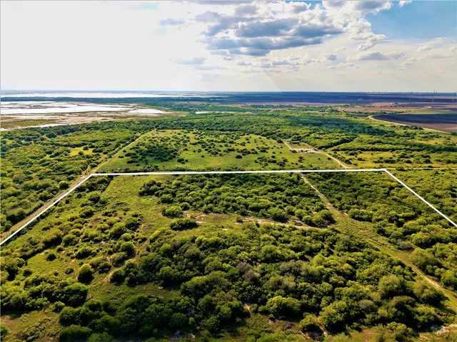 a view of a field with an outdoor space