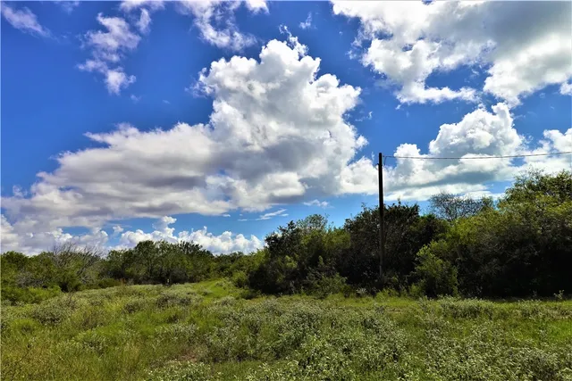 a view of a golf course with yellow lighting