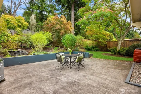 a view of a chairs and table in the patio