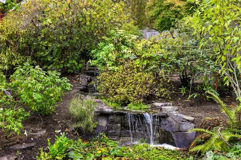 a backyard of a house with lots of green space