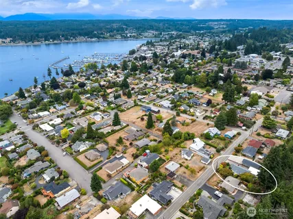 an aerial view of residential houses with outdoor space