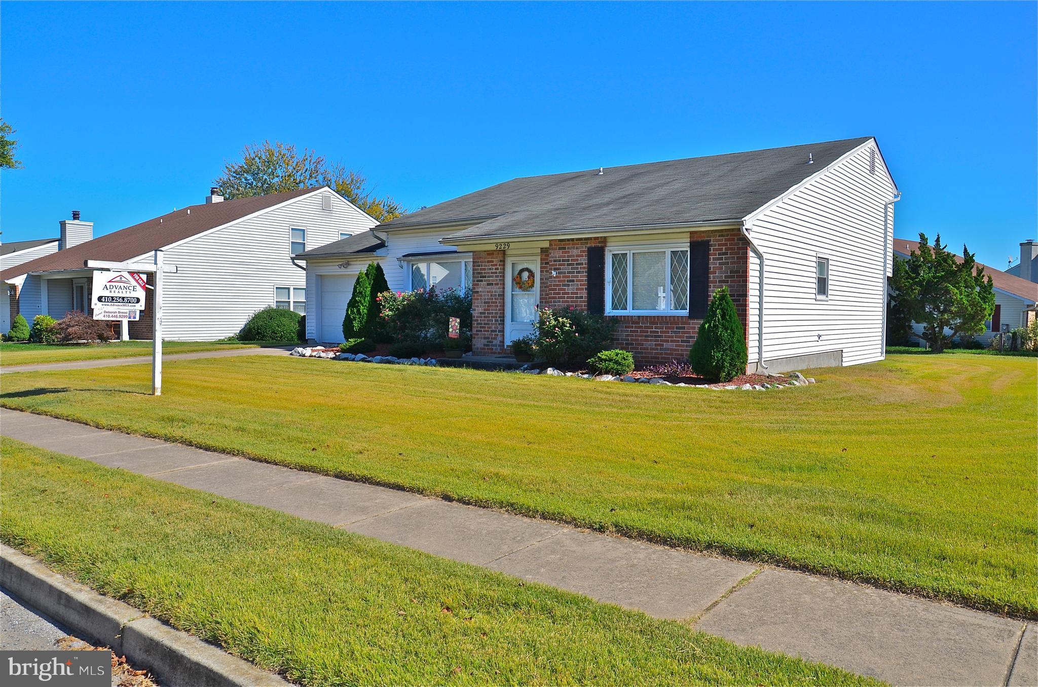 9229 Bowline Road Baltimore, MD 21236 - Photo 2 of 24 a view of a house with a yard