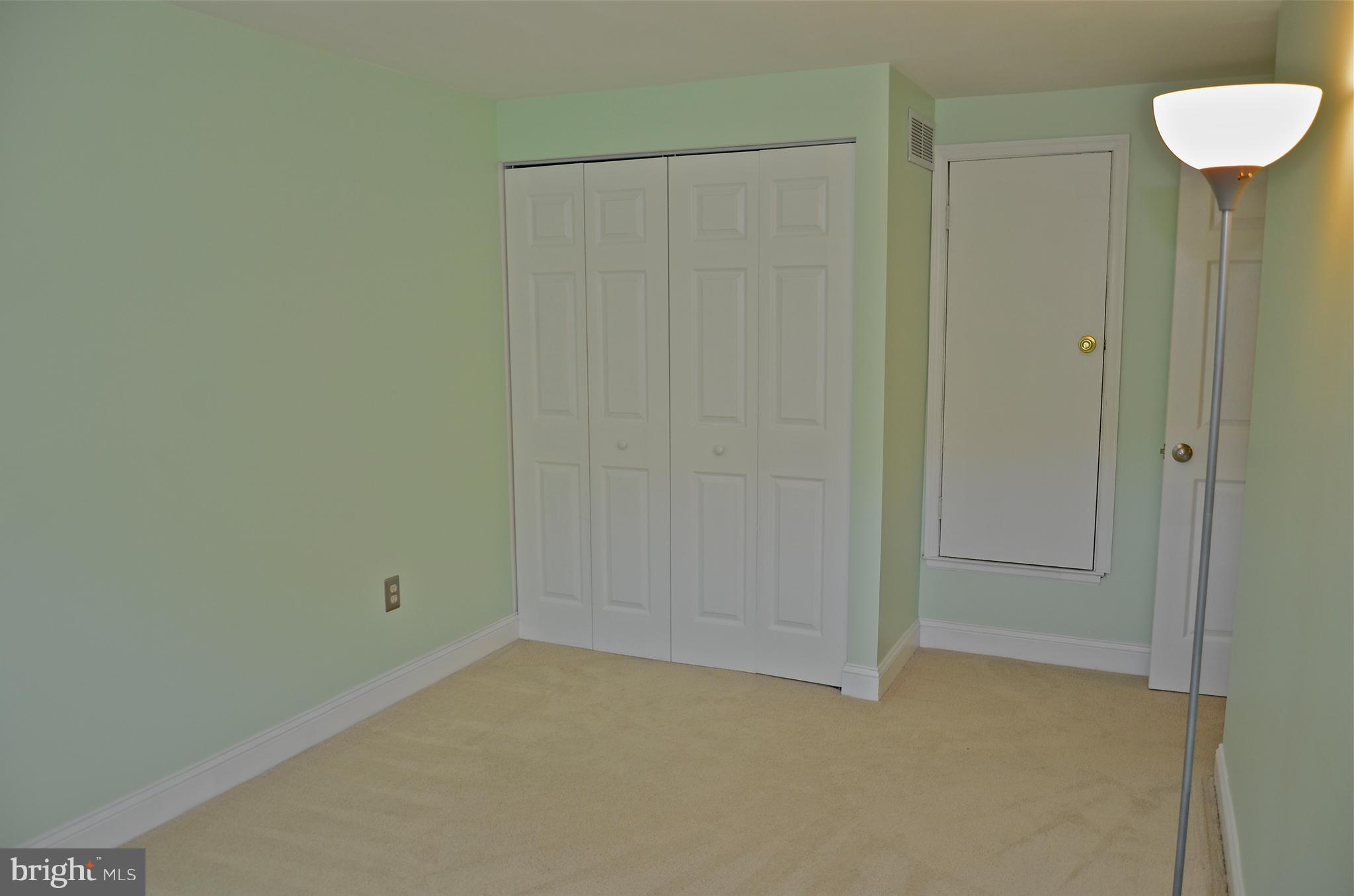 9229 Bowline Road Baltimore, MD 21236 - Photo 17 of 24 an empty room with a hallway