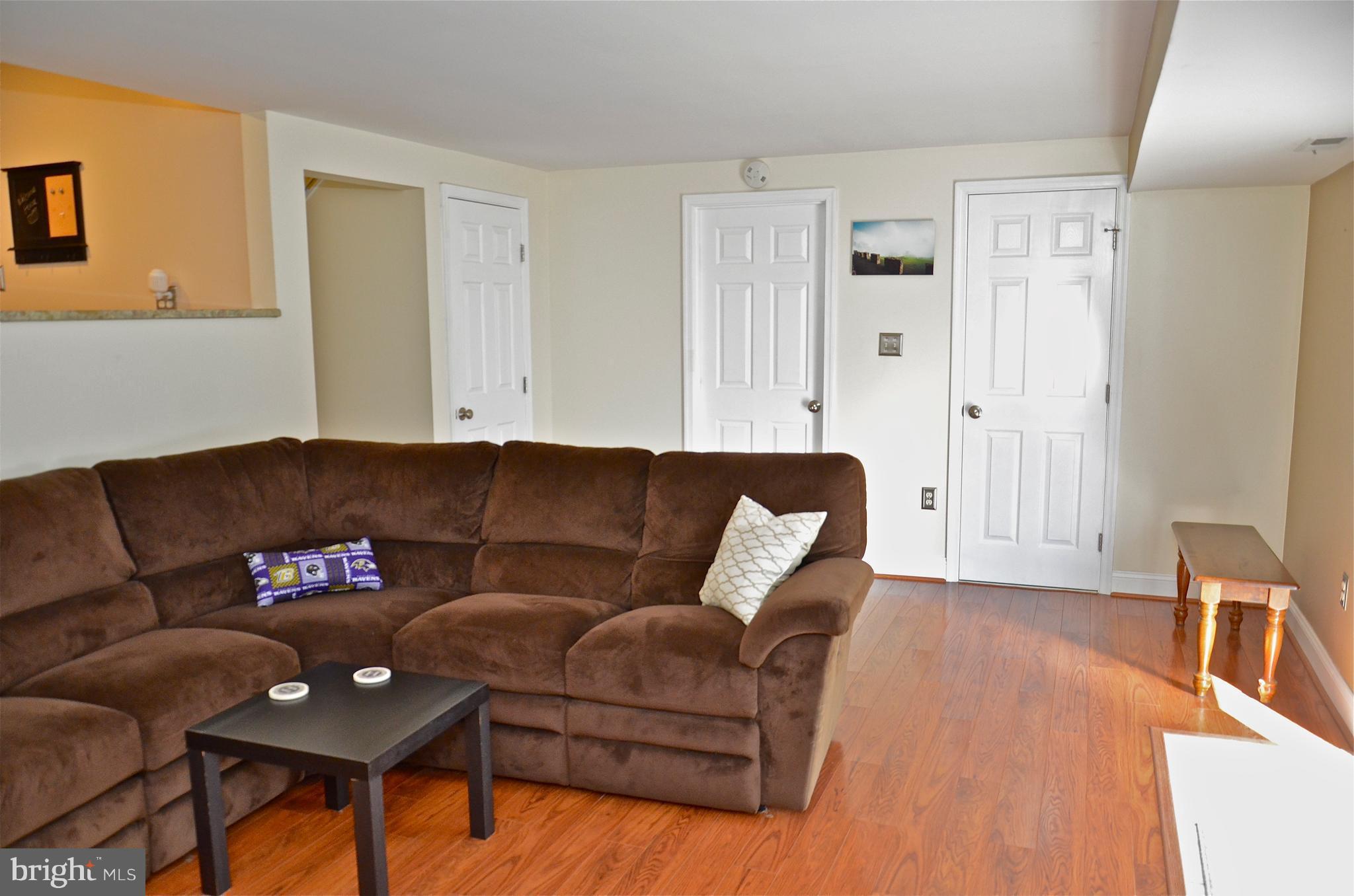 9229 Bowline Road Baltimore, MD 21236 - Photo 21 of 24 a living room with furniture and wooden floor