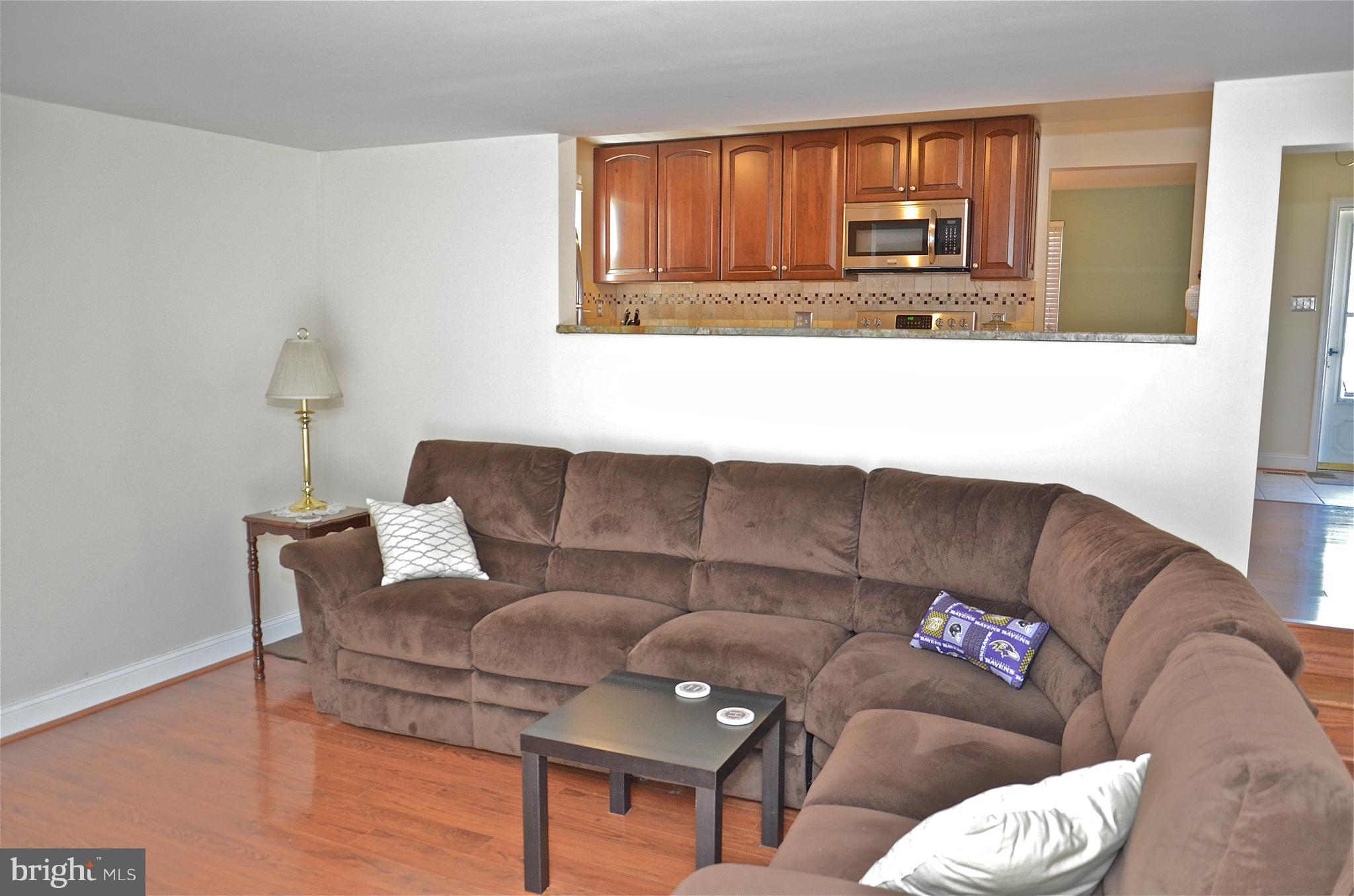 9229 Bowline Road Baltimore, MD 21236 - Photo 23 of 24 a living room with a couch and a window