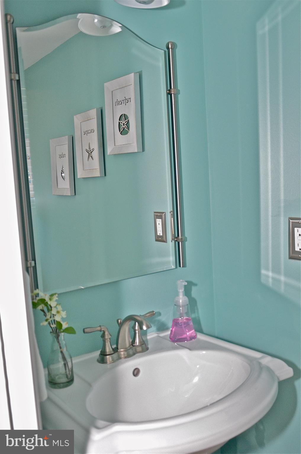 9229 Bowline Road Baltimore, MD 21236 - Photo 24 of 24 a bathroom with a sink and a mirror