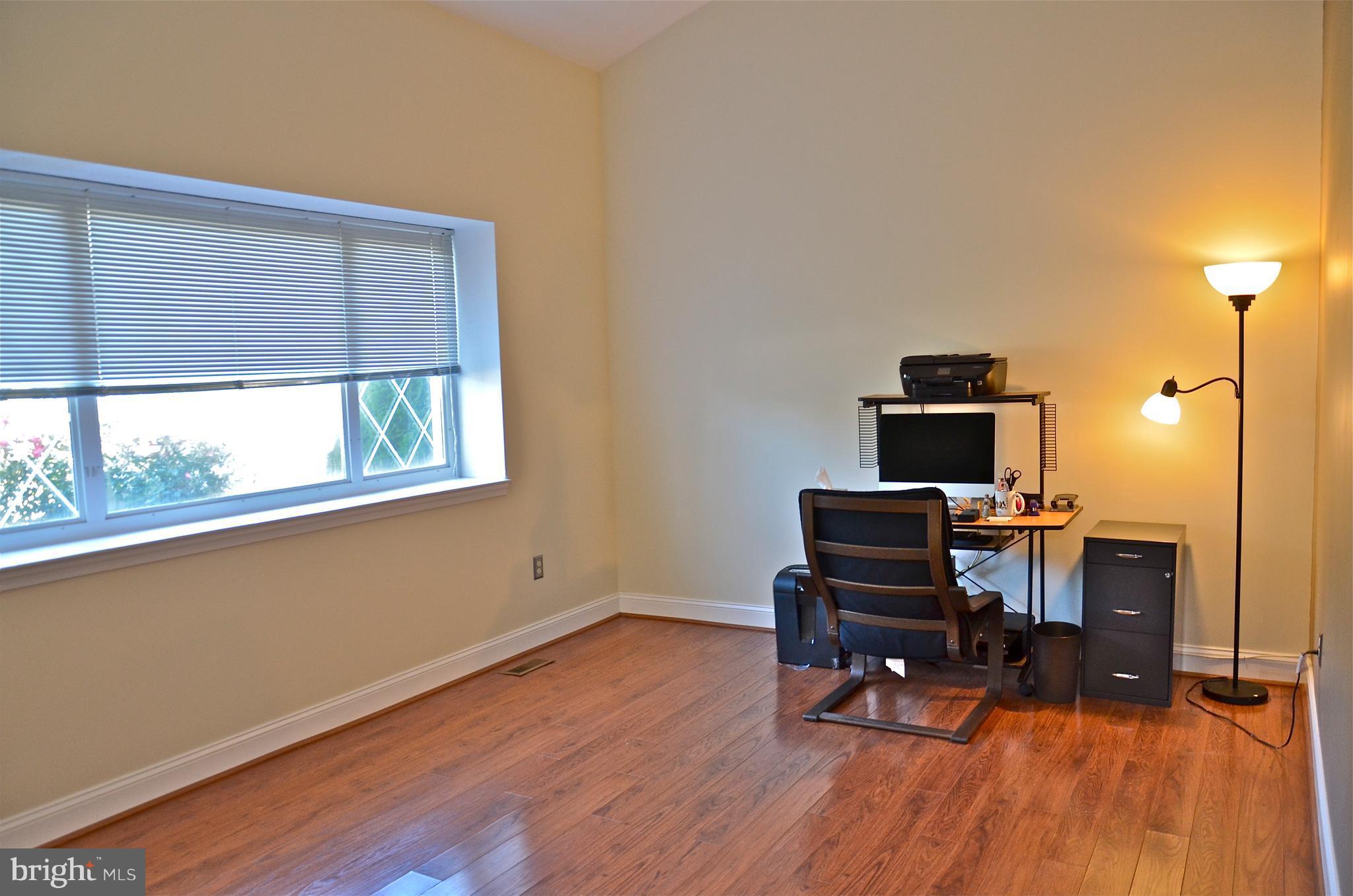 9229 Bowline Road Baltimore, MD 21236 - Photo 6 of 24 a view of a workspace with furniture and a window