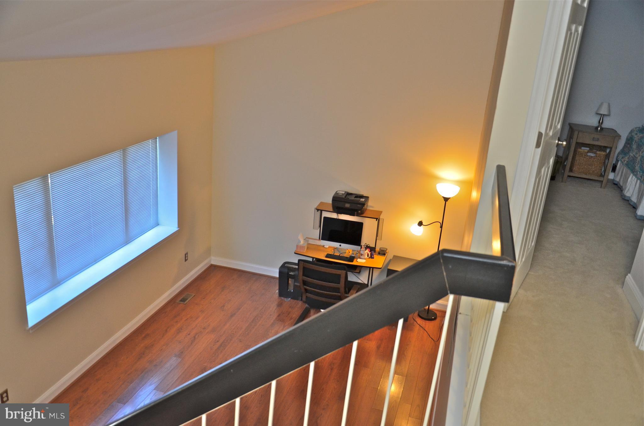 9229 Bowline Road Baltimore, MD 21236 - Photo 9 of 24 a view of a hallway with workspace