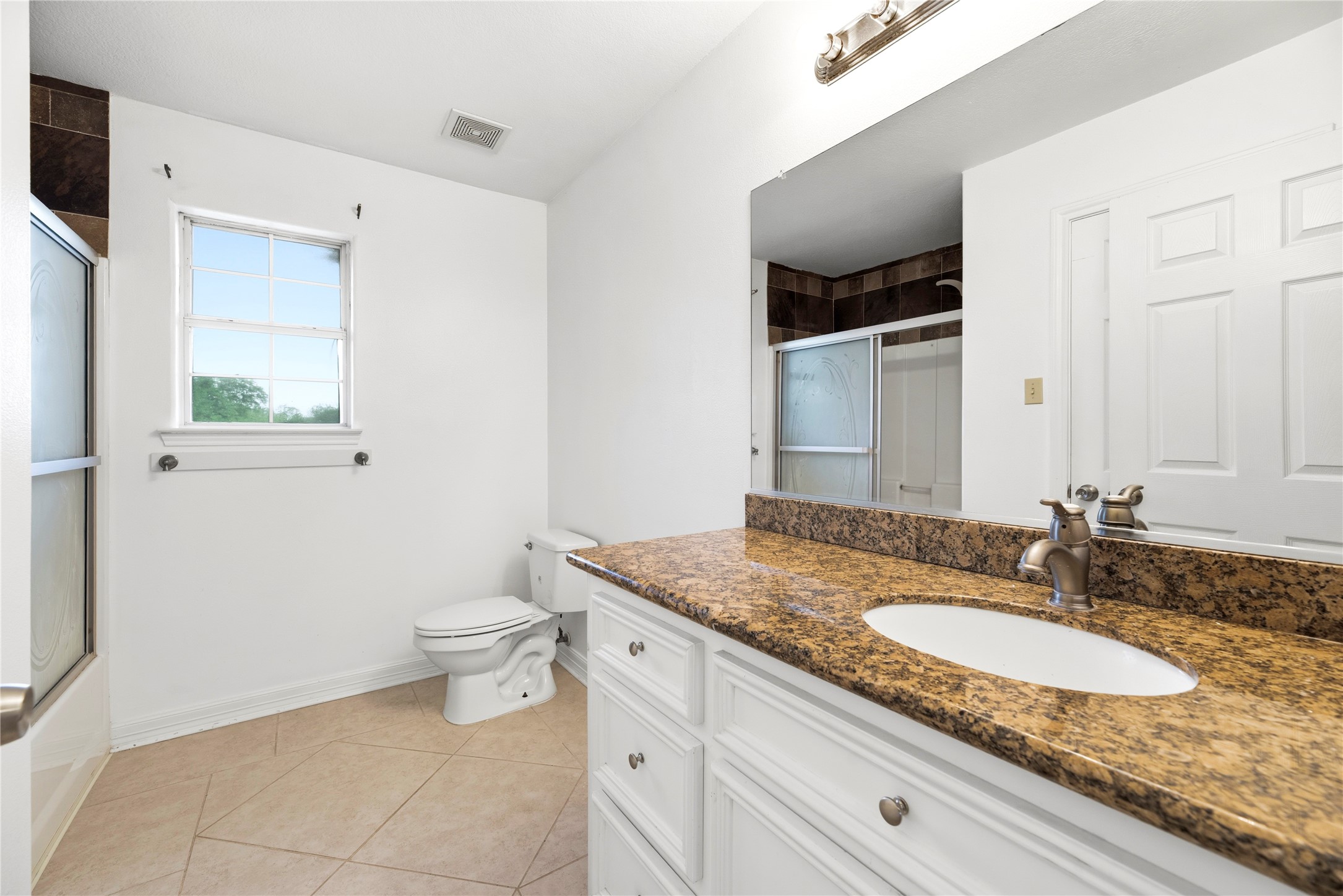 523 Moore Bar Road Rosenberg, TX 77471 - Photo 42 of 50 This is a full bath between the two secondary bedrooms upstairs.