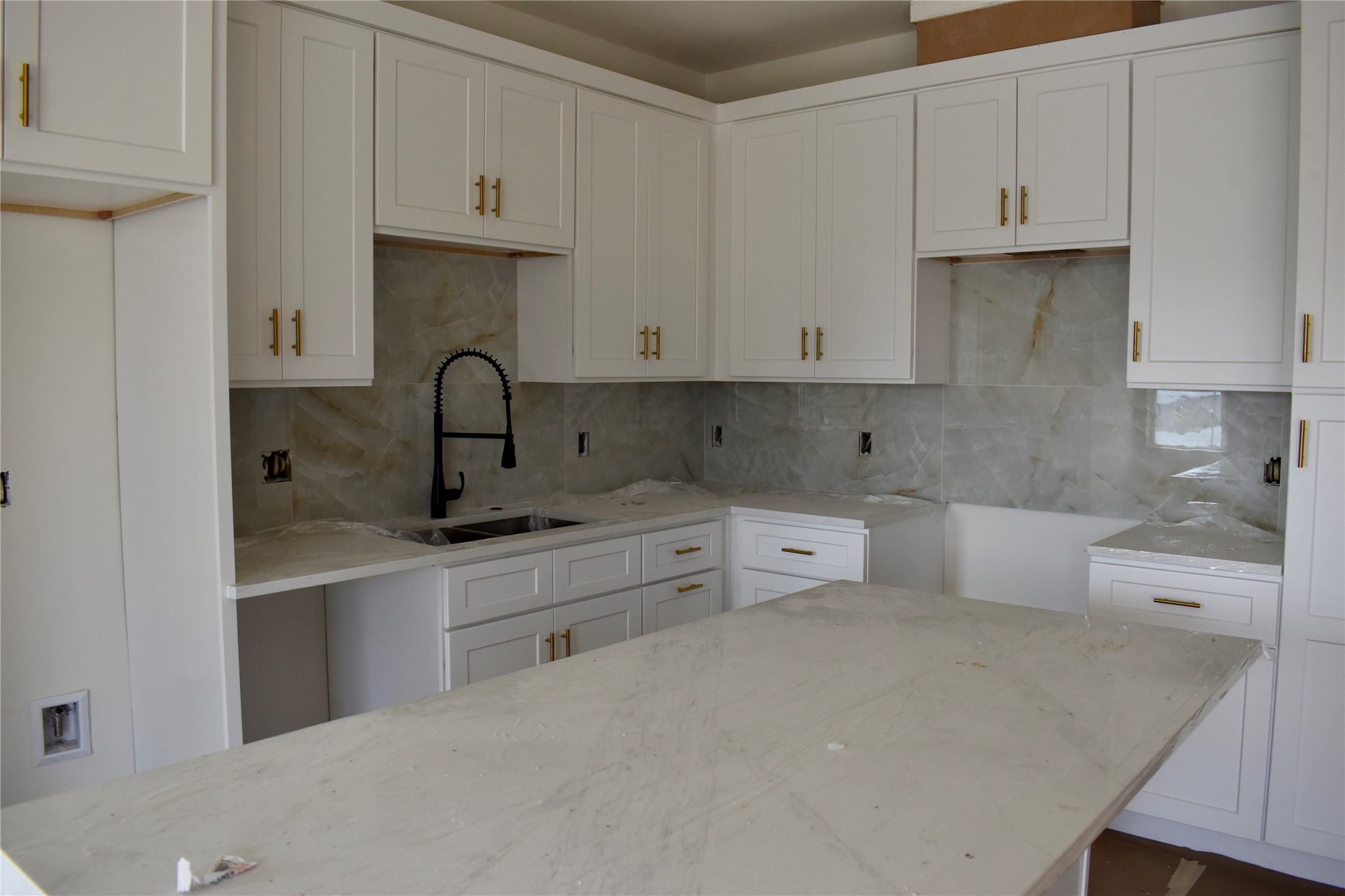 9803 Bucroft Street Houston, TX 77029 - Photo 3 of 7 a kitchen with white cabinets and a sink