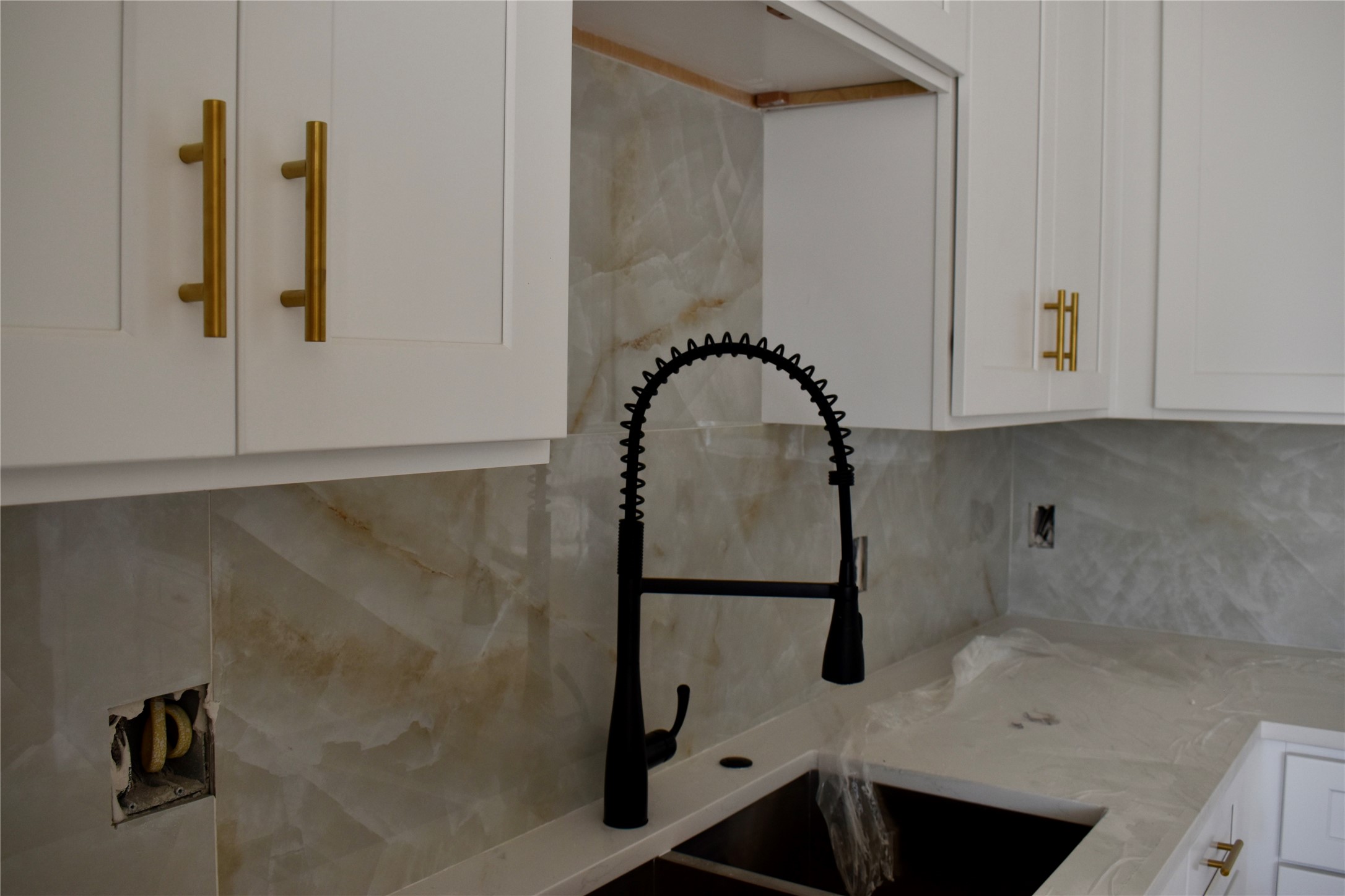 9803 Bucroft Street Houston, TX 77029 - Photo 4 of 7 a bathroom with a sink and mirror