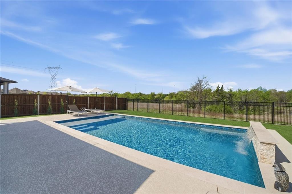 2721 Rotherham Street Prosper, TX 75078 - Photo 31 of 37 a view of a green field with wooden fence