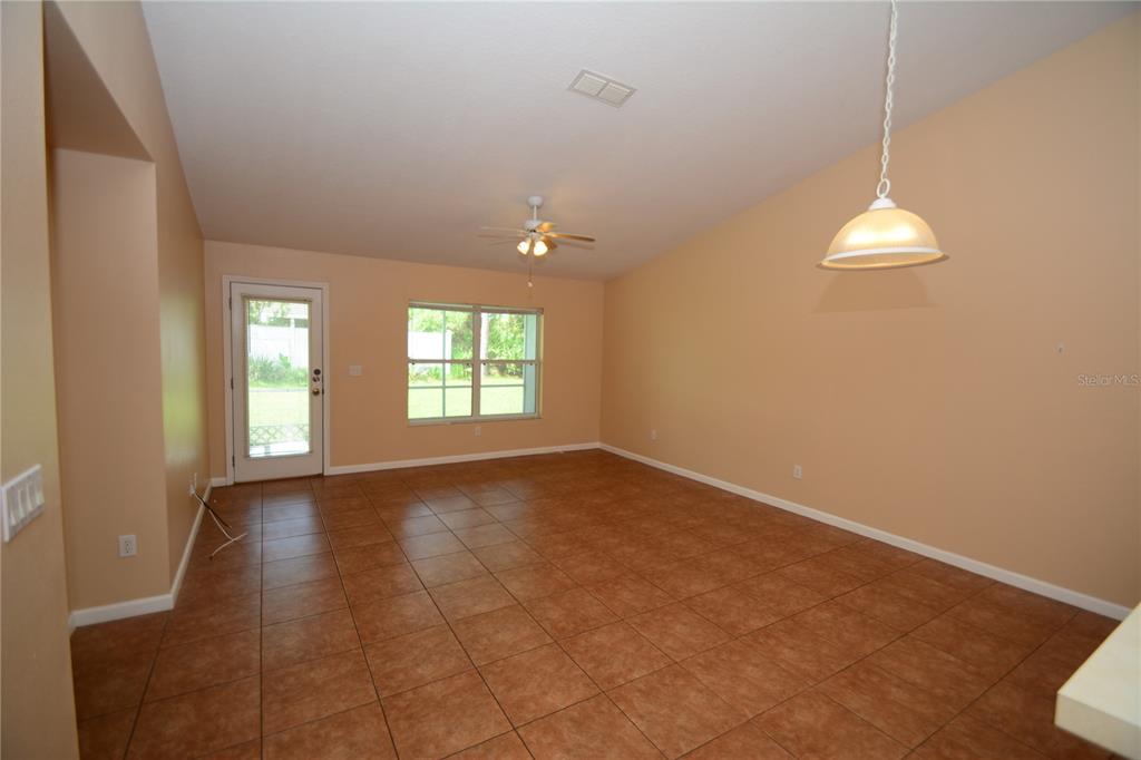 37 Eton Lane, Unit A Palm Coast, FL 32164 - Photo 16 of 34 an empty room with windows and fan