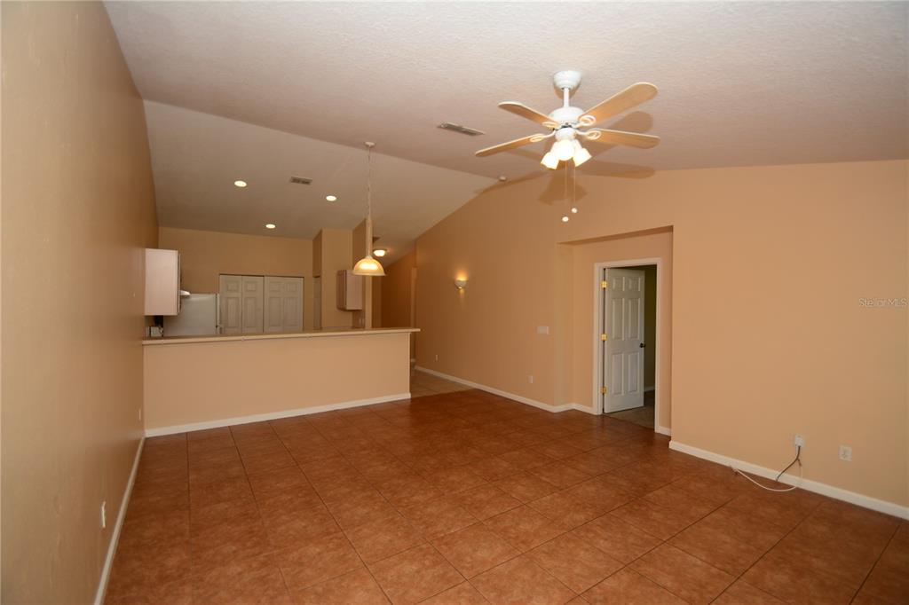 37 Eton Lane, Unit A Palm Coast, FL 32164 - Photo 18 of 34 an empty room with fan and fan