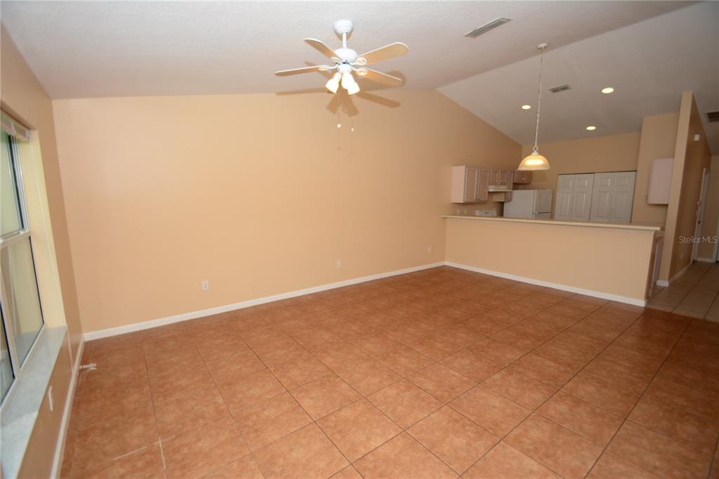 37 Eton Lane, Unit A Palm Coast, FL 32164 - Photo 19 of 34 an empty room with fan and entrance